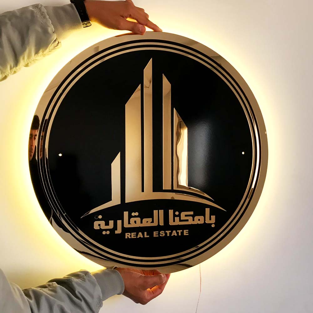 Logo acrylique personnalisé Black sign with backlit gold 3D lettering - sign in Morocco – Gifts et Decor Maroc